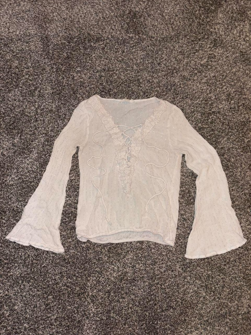 White lace long sleeve blouse with bell sleeves and lace-up front
